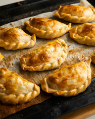 Baking delicious Argentine empanadas with chicken and vegetables.