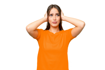 Young pretty caucasian woman over isolated background frustrated and covering ears