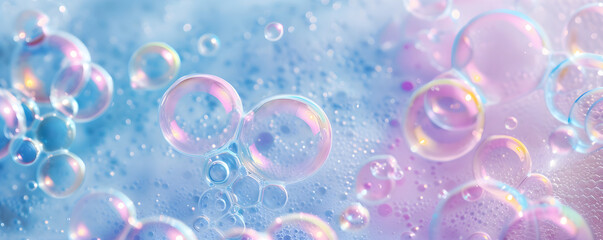 Macro photo of bubbles in water. Pink and blue background with foam made of soap, shampoo, lotion, detergent. Colorful banner with copy space for laundry and cleaning services beauty skin care concept