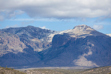 Distant mountains in desert of Arizona with a light dusting of snow.