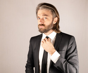 Businessman fixing tie