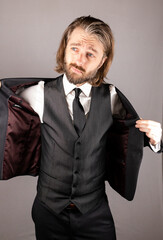 Businessman putting on jacket