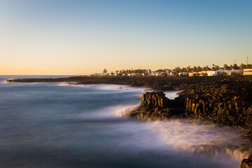 Long exposure image of sunrise over the ocean. - 733976221