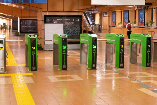 Jakarta, Indonesia - February 08, 2024: The entrance and exit tap gate at commuter line train station in Jakarta. Cikini station.