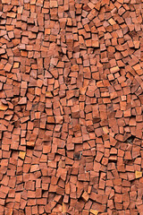 Red mosaic stones on wall