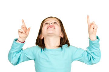 Little girl pointing up to copy space