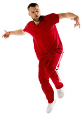 Portrait of young sportive man performing hip-hop, breakdance elements, jumping in motion against transparent background. Concept of urban and youth culture, active lifestyle. Copy space.