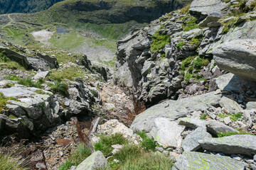 Hiking trail along unique rock strata formation with scenic view of mountain peak Seefeldkopf in...