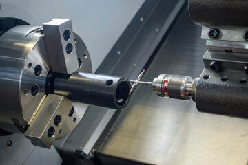 The modular touch probe checking the tube parts on CNC lathe machine. - obrazy, fototapety, plakaty