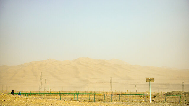 Dunhuang Silk Road Heritage City, Dunhuang City, Gansu Province - Buildings and sand dunes in the desert