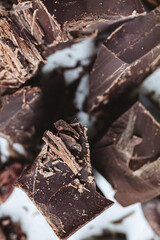 Cocoa beans with chocolate on a white background. Shalllow dof.