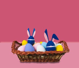 Creative Easter concept. Little rabbit and colored eggs