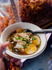 Asian style boiled square pasta soup with pork