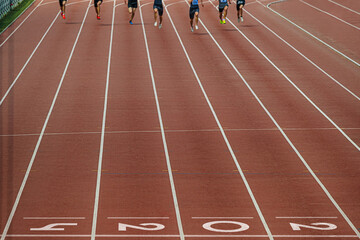 “2024” in white on finish line red running track, symbolizing summer sports games