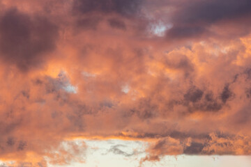 Sunset with orange golden clouds, background with copy space