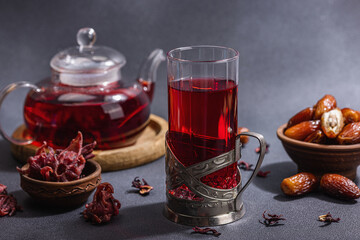 Hibiscus hot tea with dates. Traditional Ramadan Kareem concept snack for Iftar or Suhoor meal