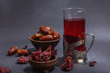 Hibiscus hot tea with dates. Traditional Ramadan Kareem concept snack for Iftar or Suhoor meal