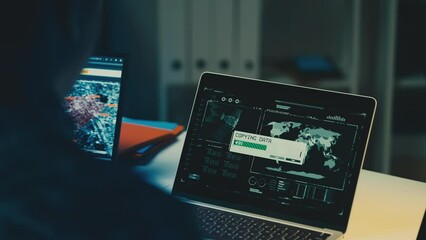 Military man copying data on computer sharing satellite intelligence with allies