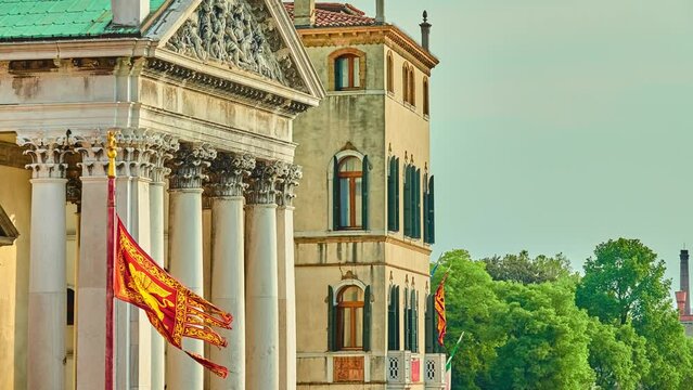 Flag of Venice and San Simeone Piccolo in sestiere of Santa Croce in Venice, Italy