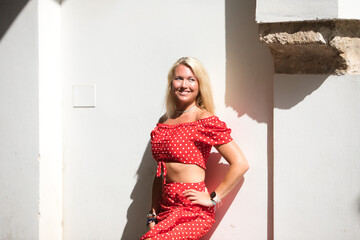 Beautiful young blonde woman from the United States is on a sightseeing trip in Seville, Spain. The...