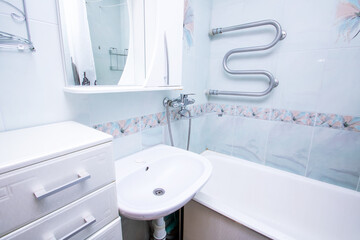 Sink and bathtub in the bathroom closeup