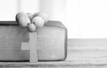 Holy Bible book and Christian cross