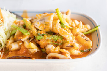 Stir fried squid with salted egg york. Delicious Thai dish.