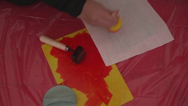 person doing chinese lithography in celebration of chinese new year in madrid city, spain.	
