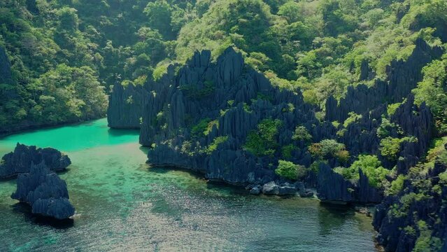 Aerial view of the typical rocks with trees of Miniloc Island in the Philippines