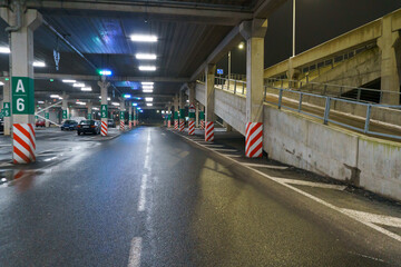 Covered guarded and safety parking with cars. Underground parking for cars. Parking lot. Selective focus, blurred background.