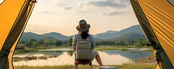 Tuinposter Asian woman travel and camping alone at natural park © kanesuan