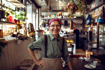 Portrait of a senior waitress in a restaurant
