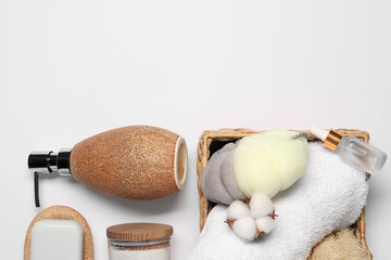 Bath accessories. Different personal care products and cotton flower on white background, flat lay...