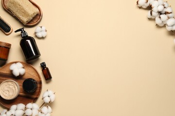 Bath accessories. Flat lay composition with personal care products on beige background, space for...