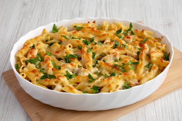 Homemade Cheesy Chicken Alfredo Pasta Bake in a Dish, side view.