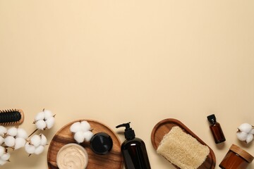 Bath accessories. Flat lay composition with personal care products on beige background, space for...
