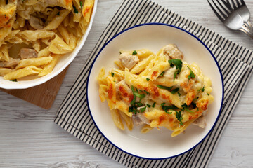 Homemade Cheesy Chicken Alfredo Pasta Bake on a Plate, top view.