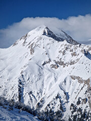 Fototapeta na wymiar Winter rocky mountain peak covered with snow, beautiful aerial view