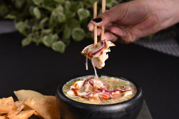 ceviche raw fish food with lemon onion pepper and lemon, healthy food