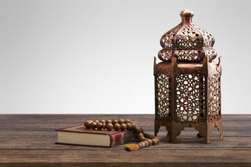 The Holy Quran book with calligraphy and beads