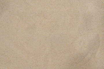Fototapeta na wymiar Clean quartz sand background. fine sand fraction texture. sand close-up top view