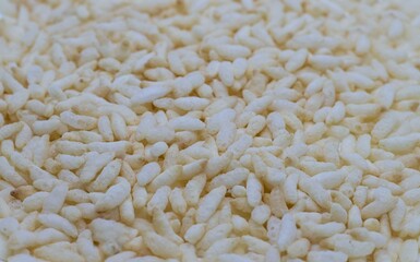 Closeup of Puffed Rice or Popped Rice Heap Background with Copy Space, Indian Snack Food
