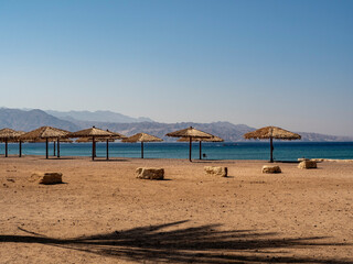 beach with umbrellas and chairs, Eilat, Israel