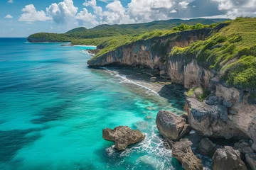 Fotobehang Drone shot of turquoise waters along a rugged coastline © Bijac