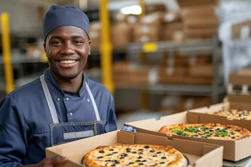  Cheerful pizzeria worker in blue apron holds pizzas in boxes, warehouse backdrop signifies busyness. Happy employee presents multiple pizza varieties, industrial setting conveys efficient delivery. © Thaniya