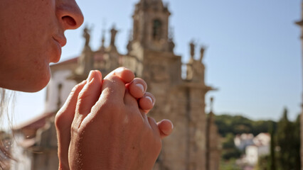 Silent Prayer: A Moment of Reflection in Historic Surroundings