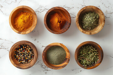 spices in wooden bowls on white background in the sty