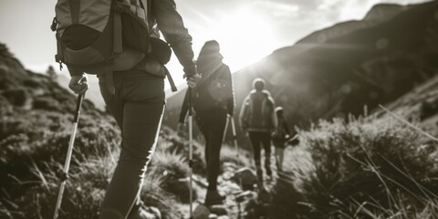 A group of people hiking up a mountain. Suitable for outdoor adventure or travel themes - obrazy, fototapety, plakaty