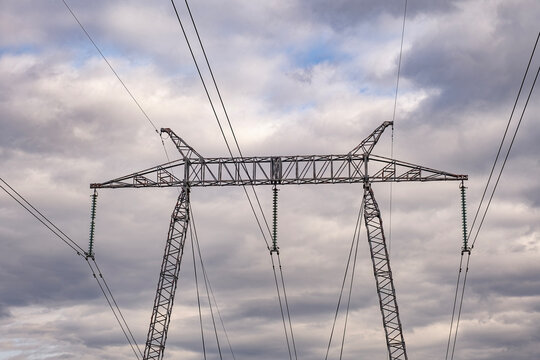 High Voltage Electric Power Grid Poles with Ceramic Insulators at Transformer Substation with Corona discharge