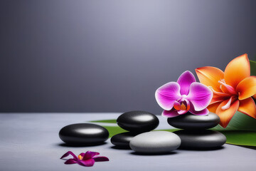 Obraz na płótnie Canvas Spa gray background with massage stones, exotic flowers and copy space.